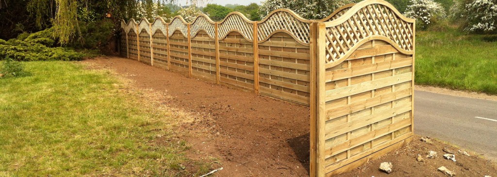 Decorative timber fence panels with curved trellis tops