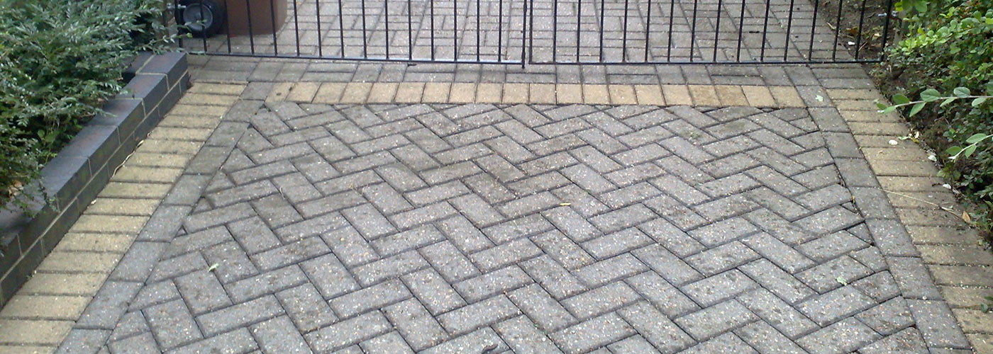 Herringbone block paving with a contrasting border