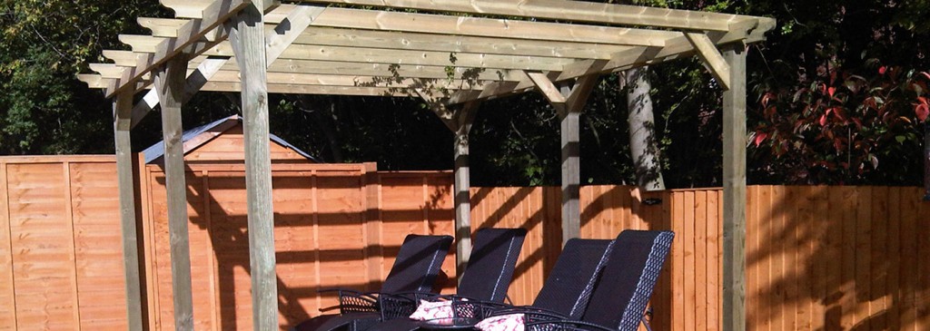 Timber pergola sheltering garden seating