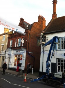 Putting up a banner across the high street with the Cherry Picker