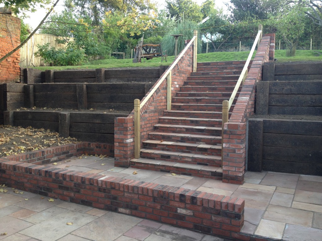 Completed garden steps between tiered sleeper retaining walls