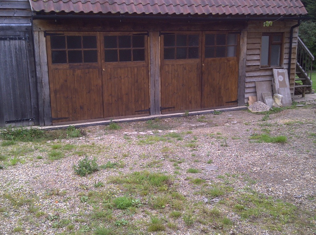 Uneven courtyard surface before landscaping