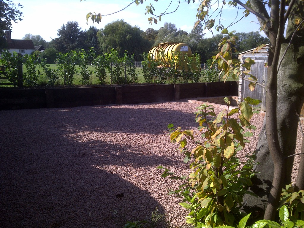 Finished gravel terrace beside a retaining wall