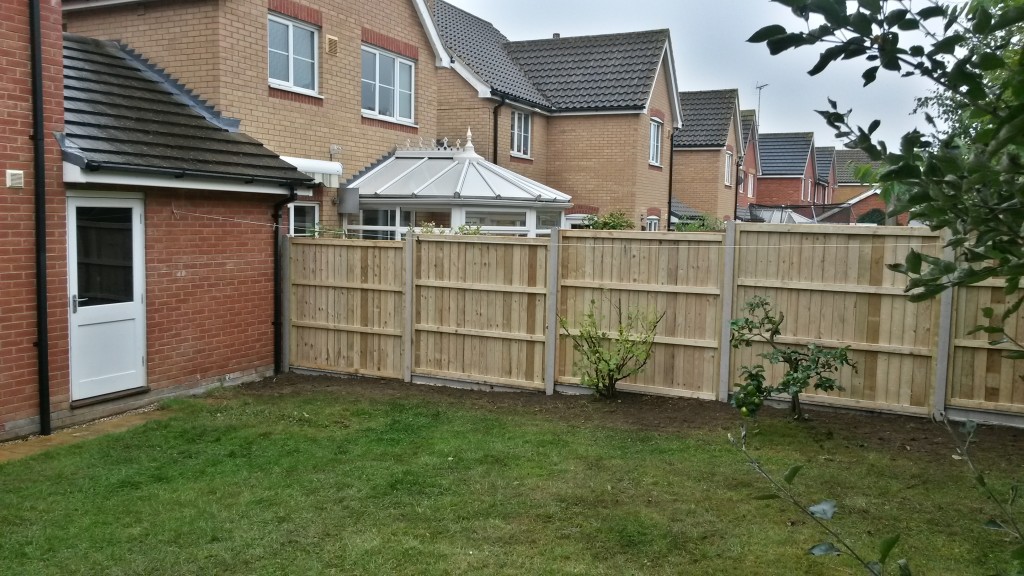 New timber garden fencing viewed from the lawn