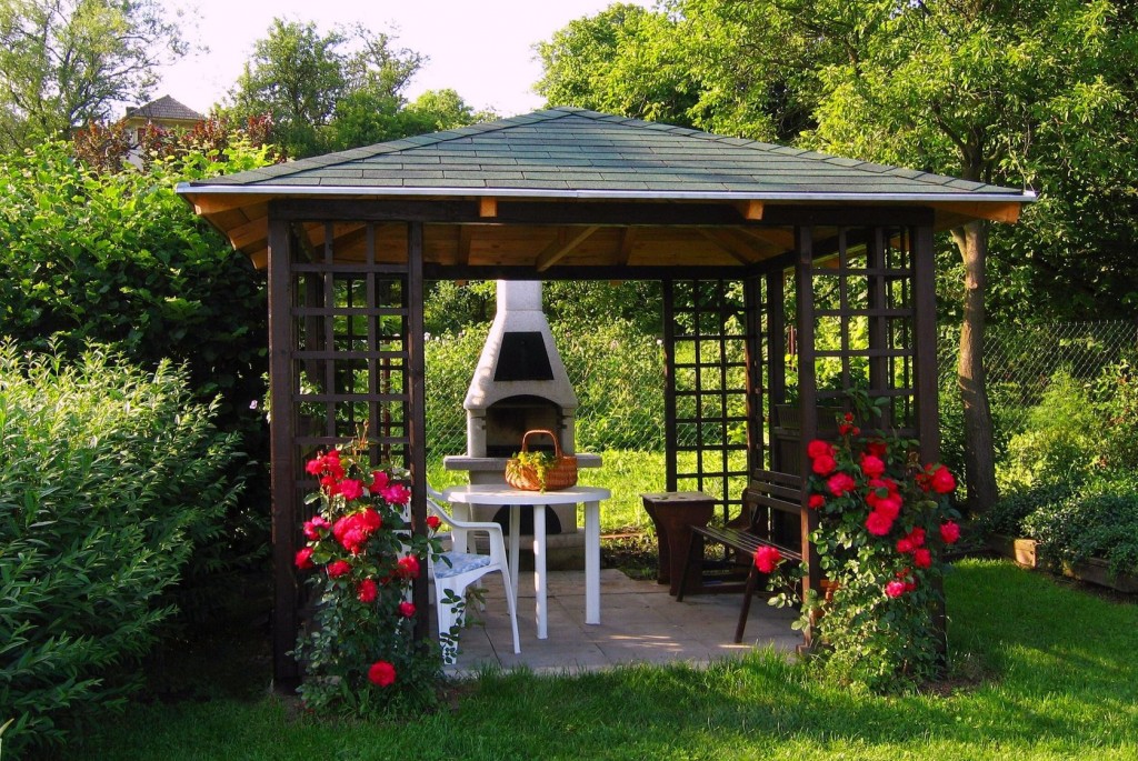Garden gazebo with climbing plants and seating