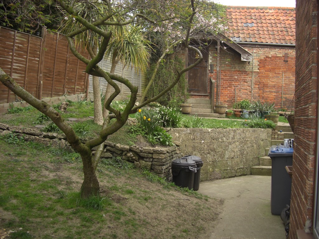 Garden before patio and retaining-wall construction