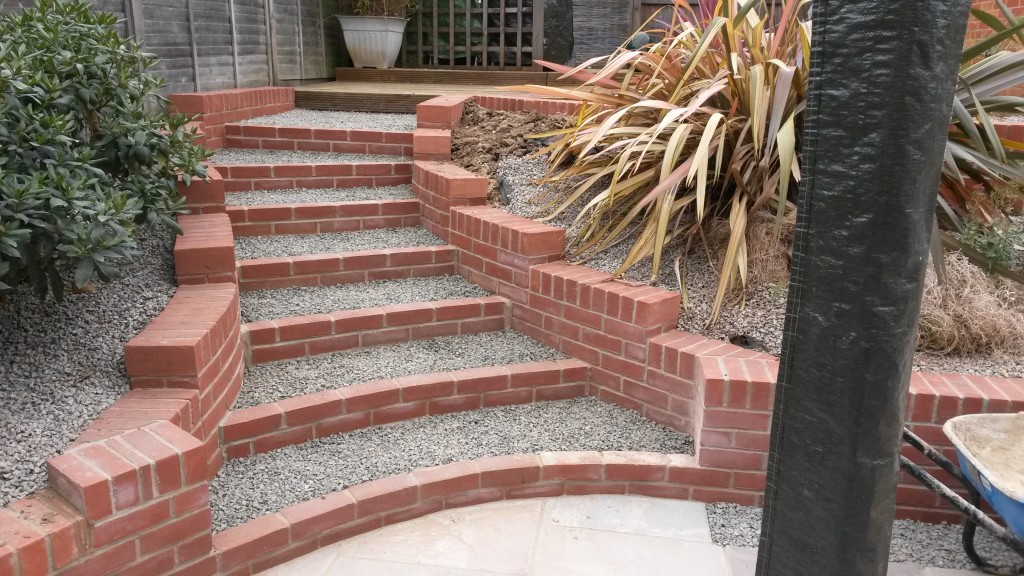 Completed brick-edged garden steps and terraced planting