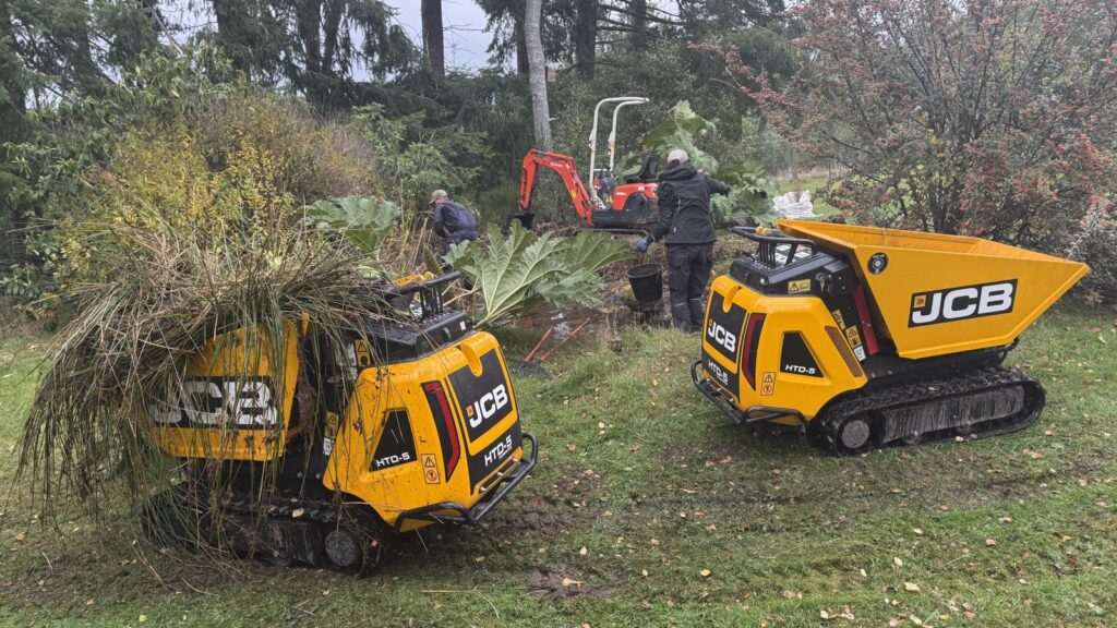 Tracked dumpers carrying removed pond vegetation during rejuvenation work in Aboyne.